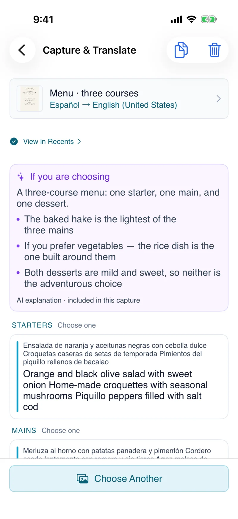 iPhone showing a photographed Spanish menu translated into English, with AI notes beneath